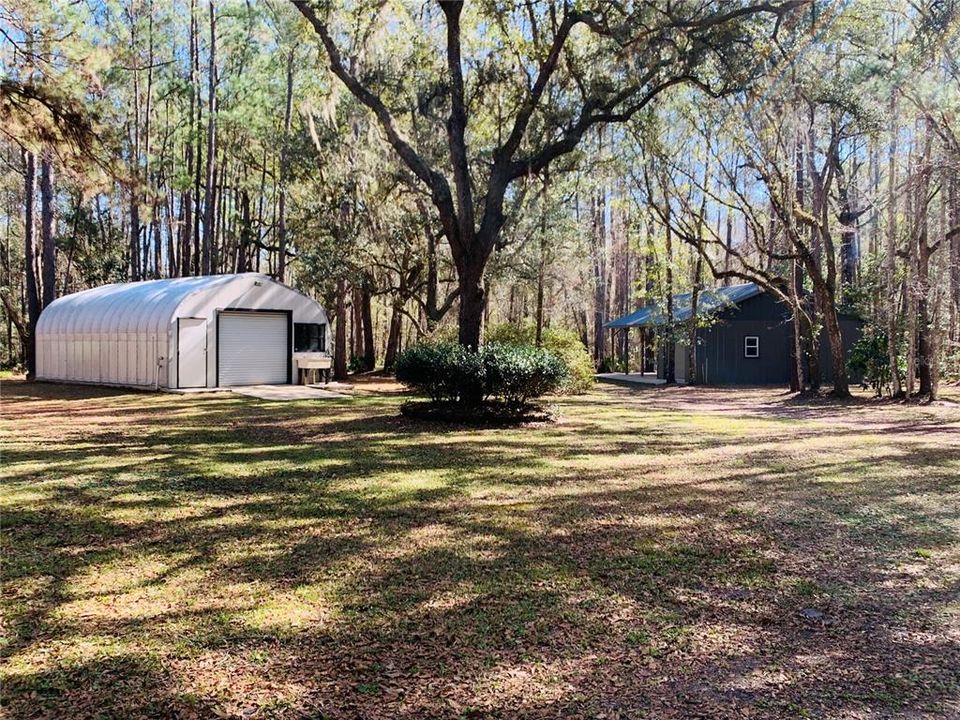 workshop & equipment barn located on back side of property