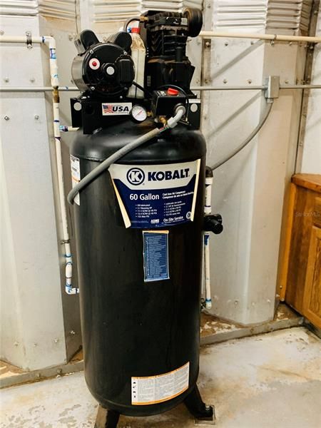 60 gal air compressor in workshop