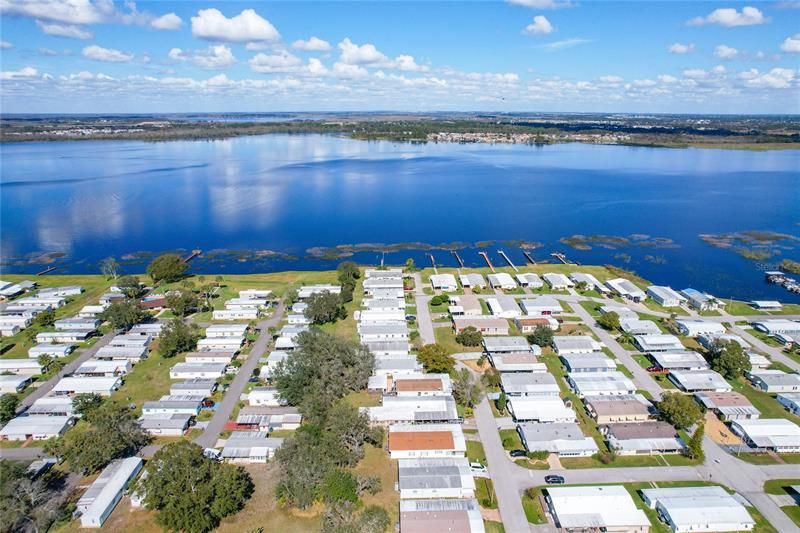 Aerial view of the community and the lake, make this amazing place your home today!