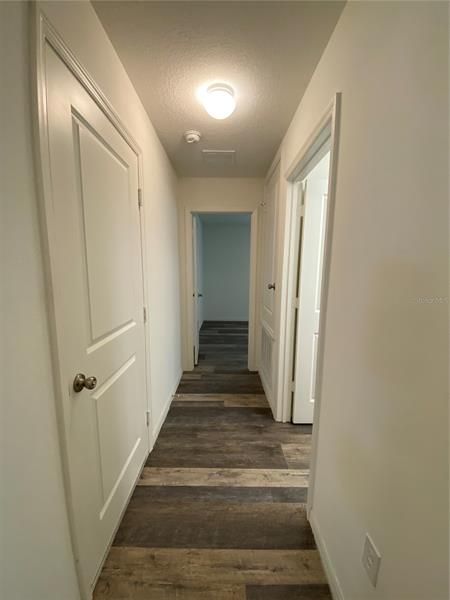 Hallway leading to Garage, Laundry Room and Bedroom Two
