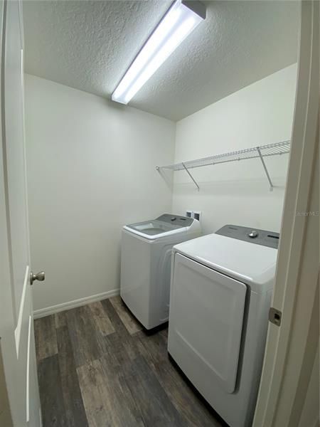 Laundry Room with Washer and Dryer Units