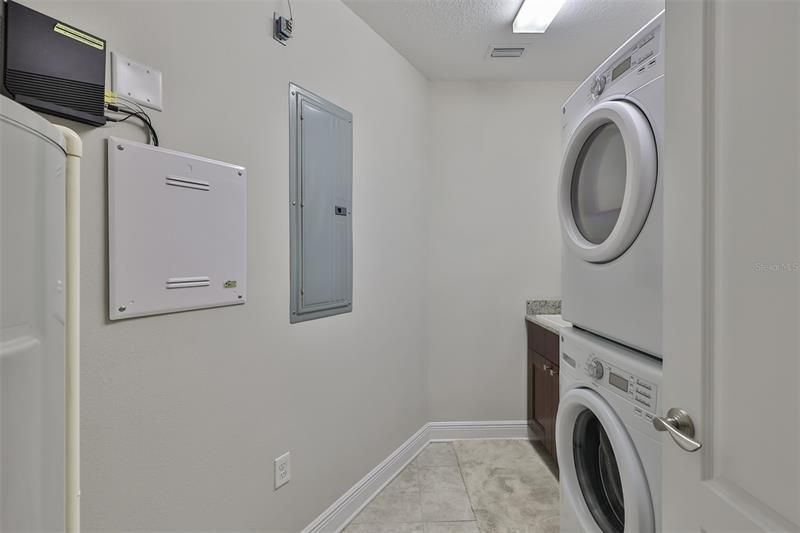 Laundry/utility room.Sink and cabinet on other side of w/d
