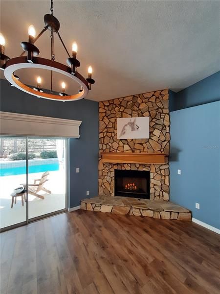 Floor to Ceiling Stone Fireplace with Oversized Custom Poplar Mantle
