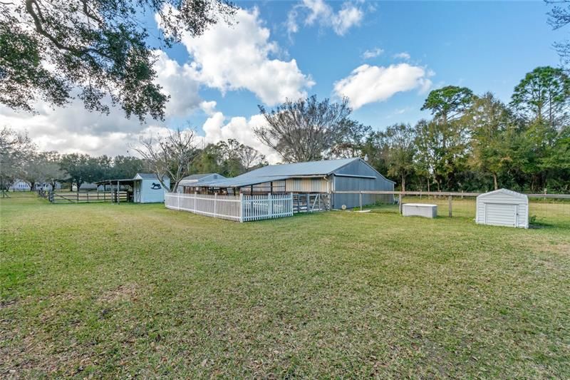 Enoy your HUGE Barn/Workshop and multiple outbuildings and storage units. This expansive 5 acres of land offers plenty of room for gardening, recreation, and even raising animals.