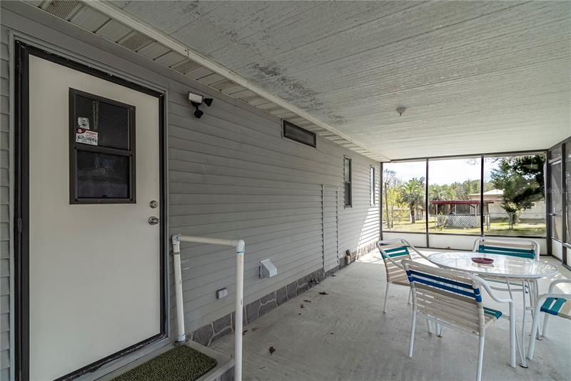 Screened in patio with second entrance.