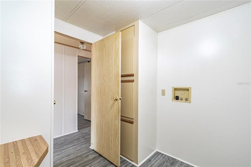 Laundry room with plenty of storage.