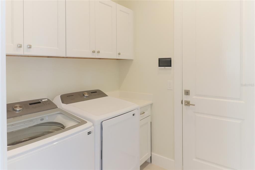 Laundry room with extra cabinets..