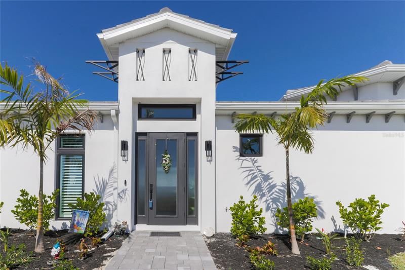 A stunning entrance with paver sidewalk.