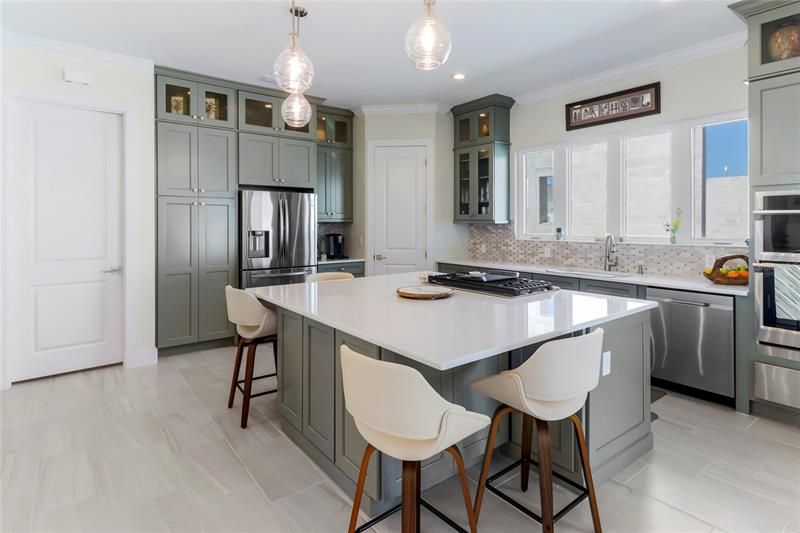 Or come and dine in your spacious kitchen with its 7 foot island.
