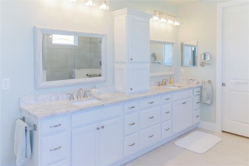 Double sinks and large quartz vanity.