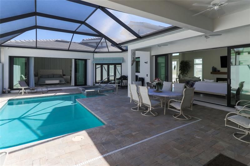 The courtyard has both covered space and is enclosed with a screened in lanai.