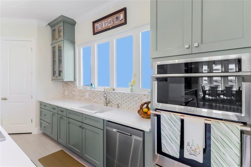 Double ovens and a warming drawer round out the kitchen.