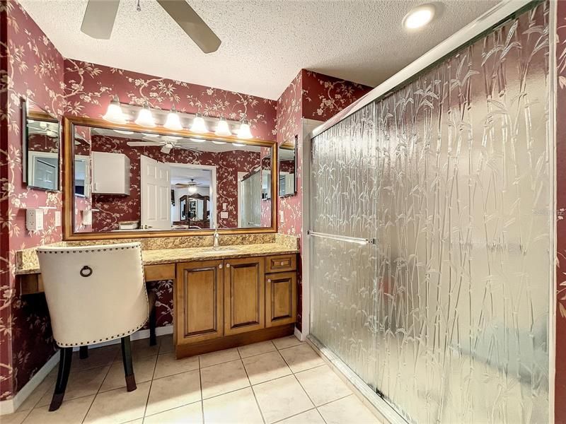 Elegant master bath with opaque shower doors