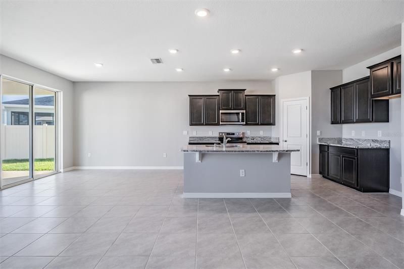 Kitchen with Dinette area overlooking Lanai and backyard