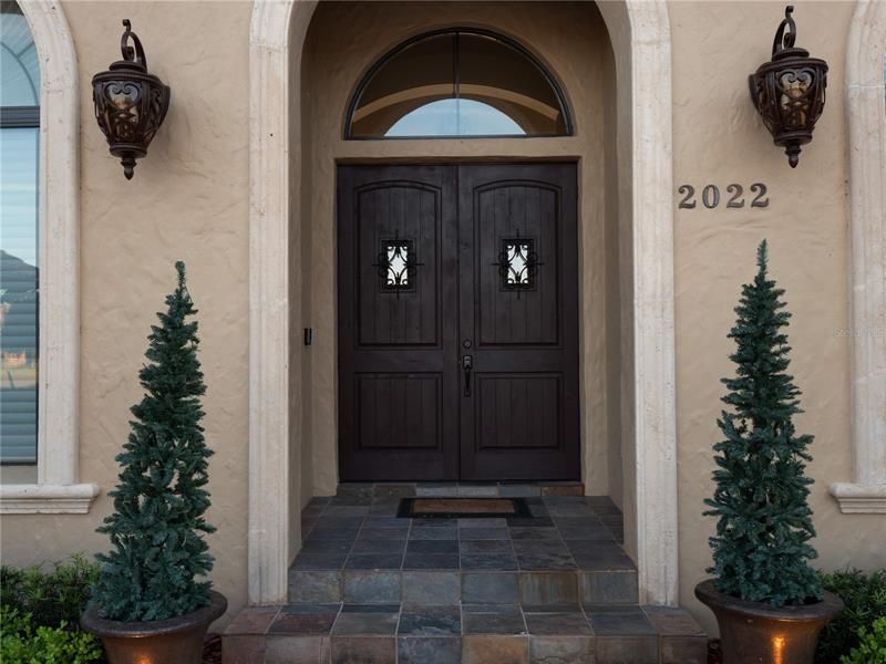 Brand new solid wood doors greet guests as they arrive at the home.