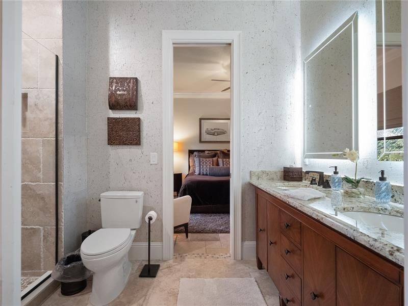 The newly updated Jack and Jill bathroom connects the second and third guest bedroom and is located along the left side of the home. The bathroom has new vanity, counter tops, walk in shower, toto toilet, shower heads and faucets.