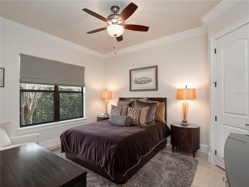 In each of the ample secondary bedrooms enjoy new built-in hanging and drawer closet systems. The pictured 3rd bedroom is located on the left hand side of the home and shares a Jack and Jill bathroom with the 2nd bedroom. A newly-created closet between bedrooms 2 and 3.