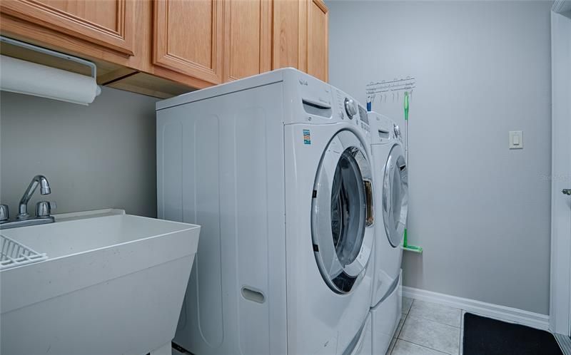 Laundry Room with Utility Sink and Storage.