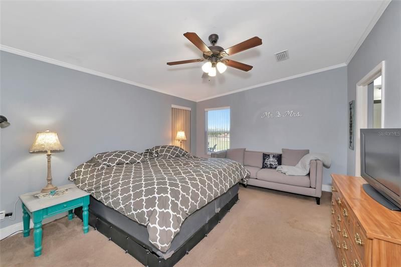 Master bedroom is large enough to also have a couch in the room.