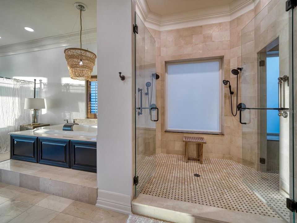 Primary bathroom includes oversized walk-in shower and steam room.