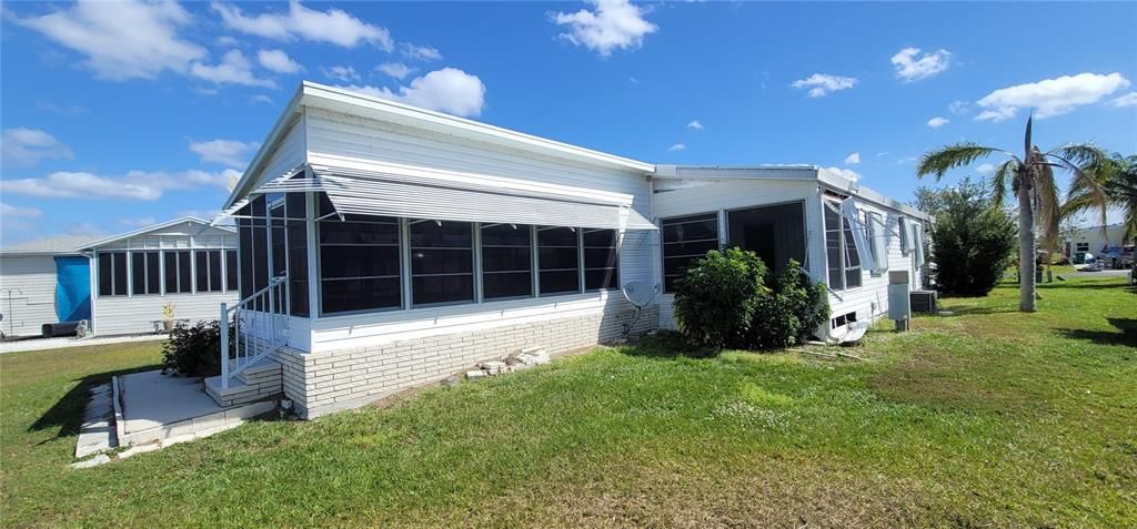 Rear view of home showing potentially reusable enclosed sun porch