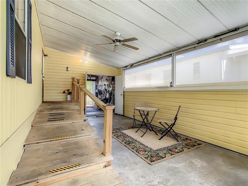 Screened lanai and access to the spacious storage shed