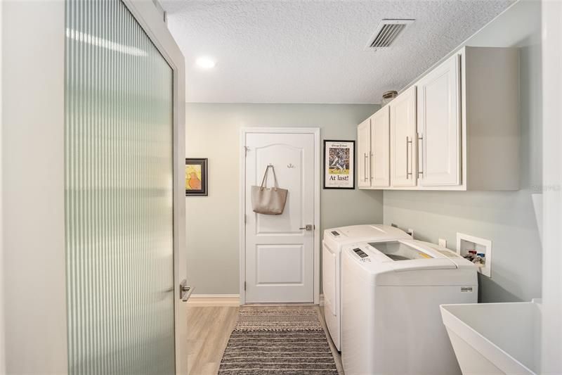 The laundry room.  Notice the updated door with a glass insert from the kitchen.