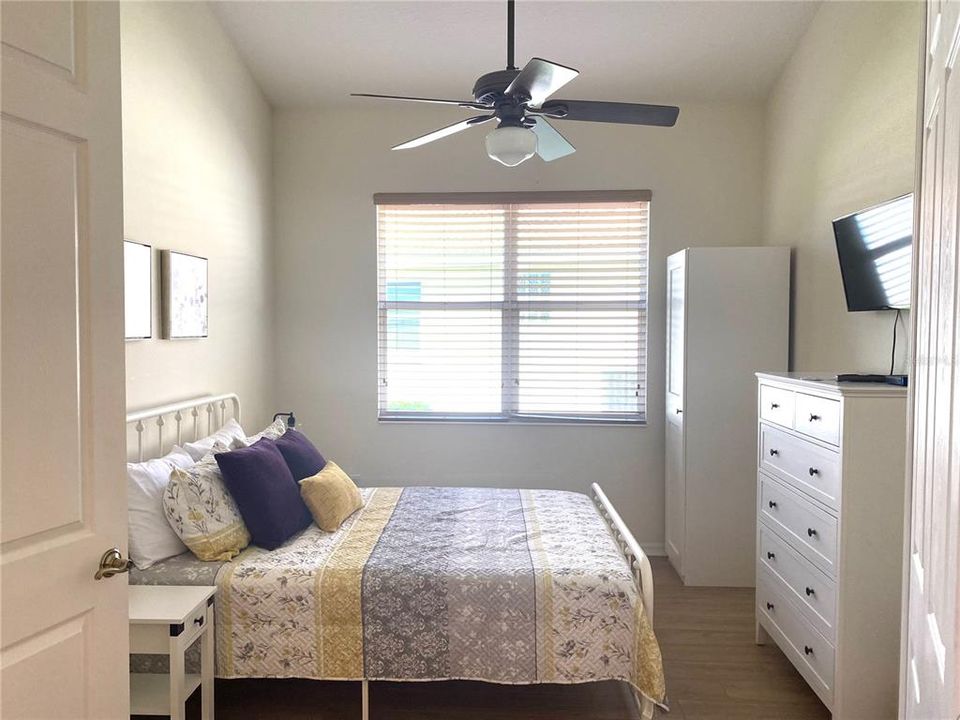 middle bedroom with armoire for closet spacequeen