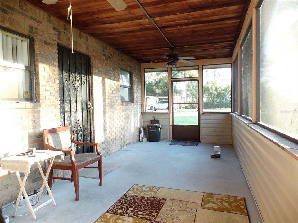 spacious 9ft x 22ft  screened front porch.