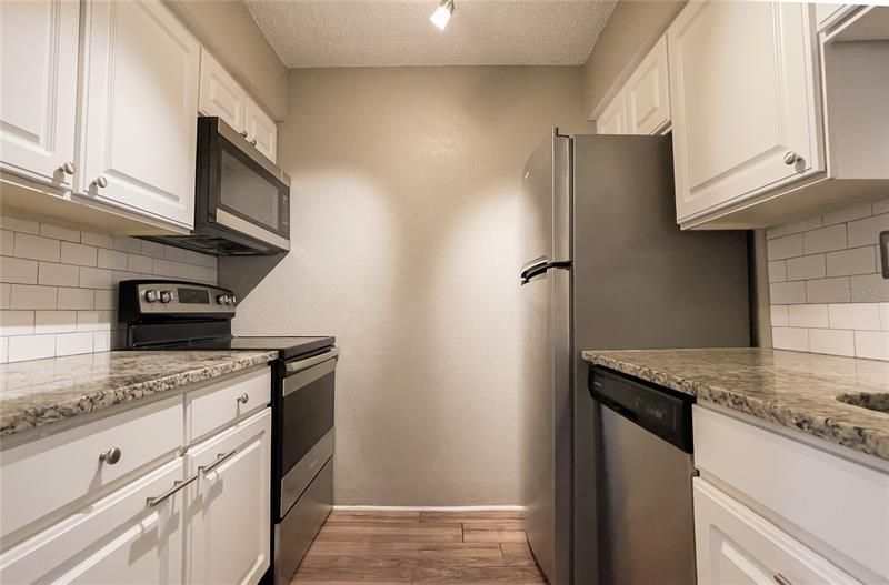 Renovated kitchen with granite counters