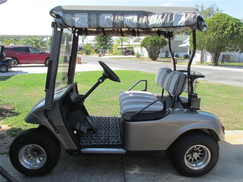This really nice golf cart goes with the home, too!