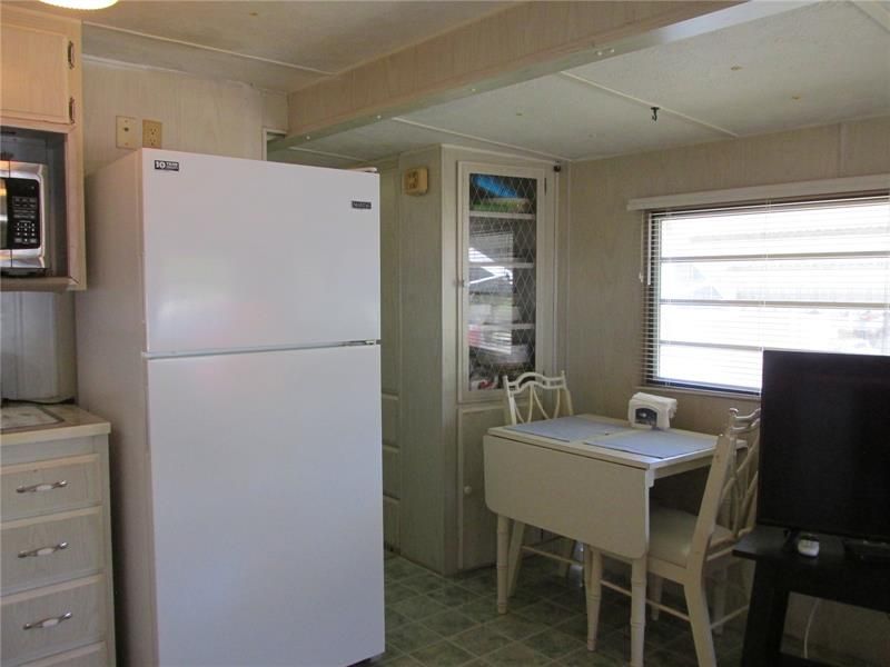A small breakfast nook is adjacent to the kitchen.