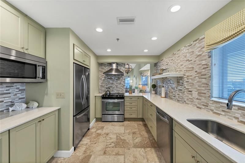 Kitchen offers Quartz counters, soft close cabinetry & stainless appliances