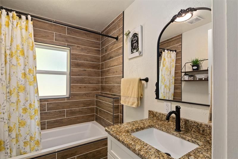 totally remodeled bath with ceramic tile tub/shower