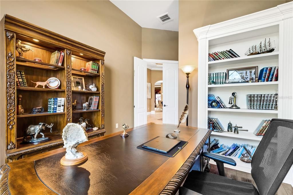 OFFICE with ENGINEERED WOOD FLOORING.  NOTE the white built in shelving and this room also has a closet.  Do you need a nursery close to the MASTER side????