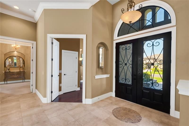 WELCOME into your Foyer showing entry thru double glass doors to OWNER SUITE as well as the entry to OFFICE or NURSERY if needed!