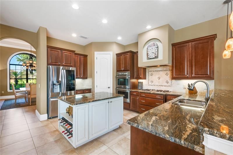 KITCHEN showing DOUBLE CONVECTION OVENS - GAS COOKTOP - WALK IN PANTRY - WINE STORAGE