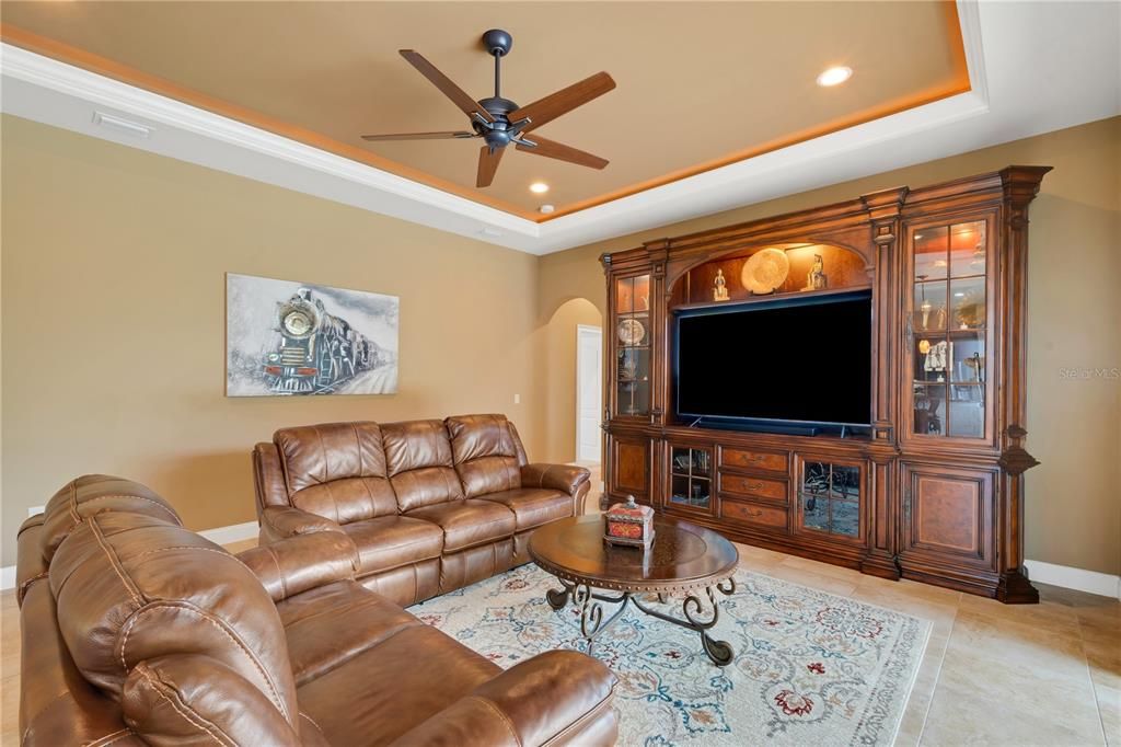 FAMILY ROOM with lighted TRAY CEILING and CROWN MOLDING