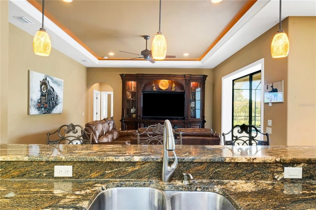 KITCHEN BAR SEATING with view to Family Room