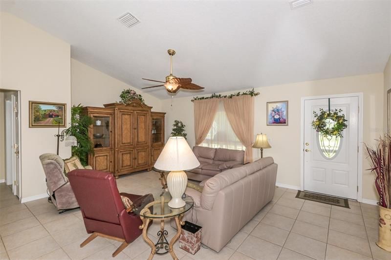 Living Room with Vaulted Ceiling & Ceramic Tile