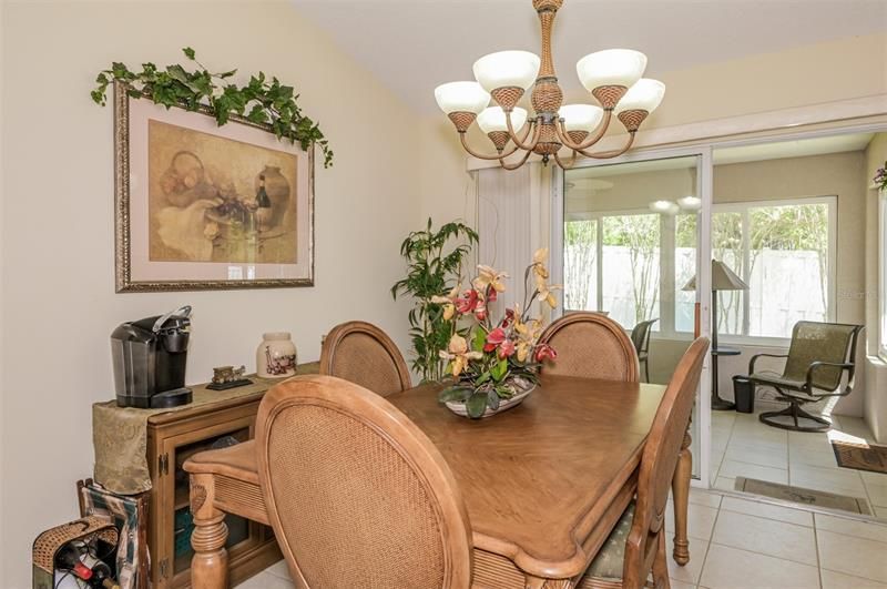 Dining Area has slider that opens to Sunroom