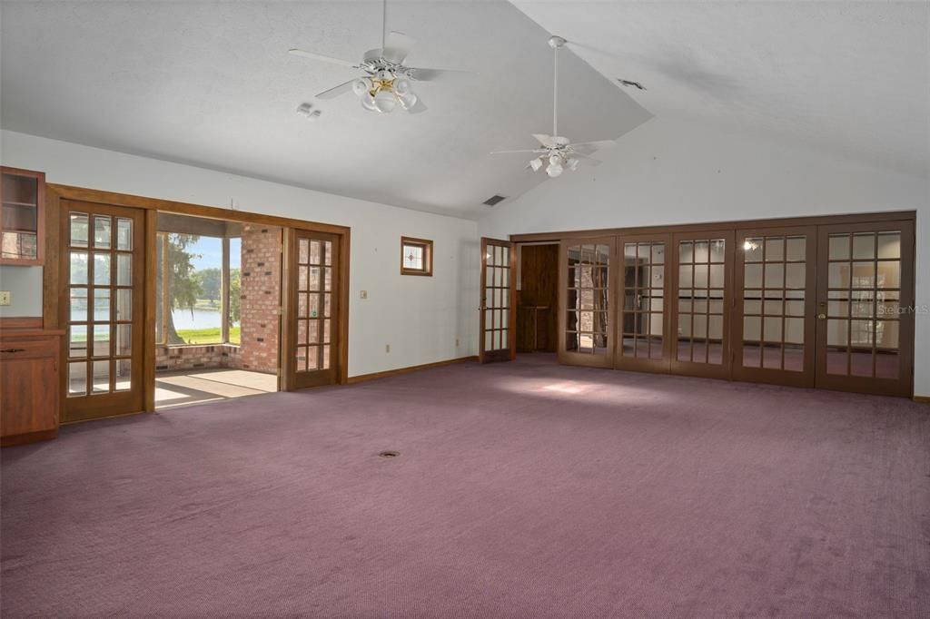 Great room looking S to screened lanai/porch