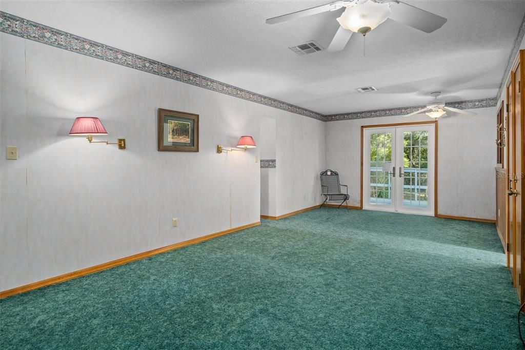 Upstairs Bedroom over garage with balcony.