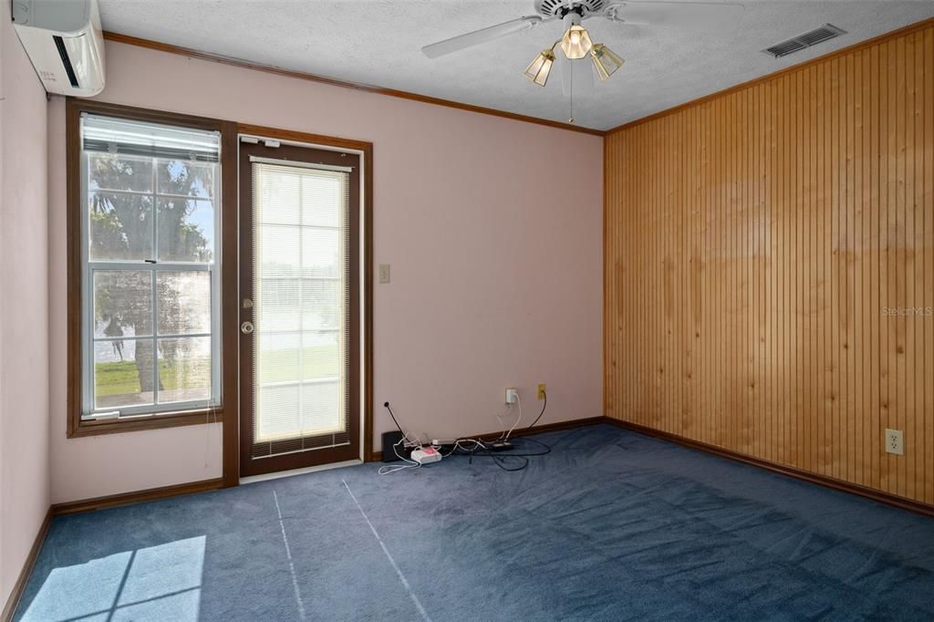 Bedroom 3 upstairs with access to balcony.