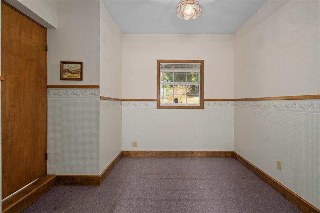 Mud Room or could be another small bedroom. Leads to garage and another full bath.