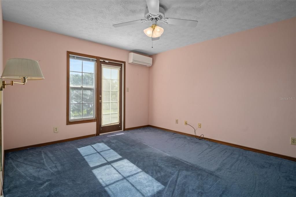 Upstairs Bedroom 2 with balcony access.