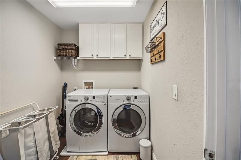 Indoor Laundry room with new cabinets