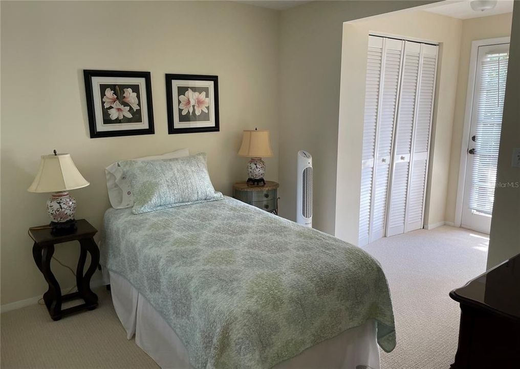 Small bedroom shares ladies master bath.  It also has a door to the beach.