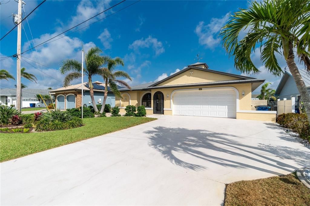 This beautiful pool home on the water,has an oversized driveway for extra parking