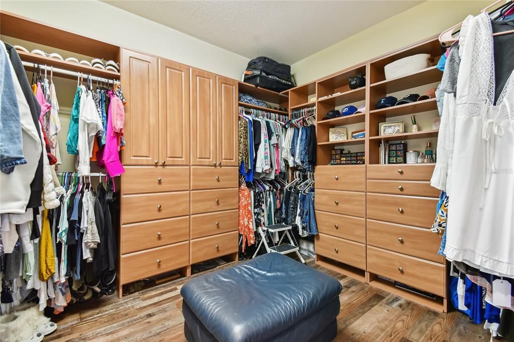 This is the larger of two walk in closets, both provide ample storage and custom built-ins